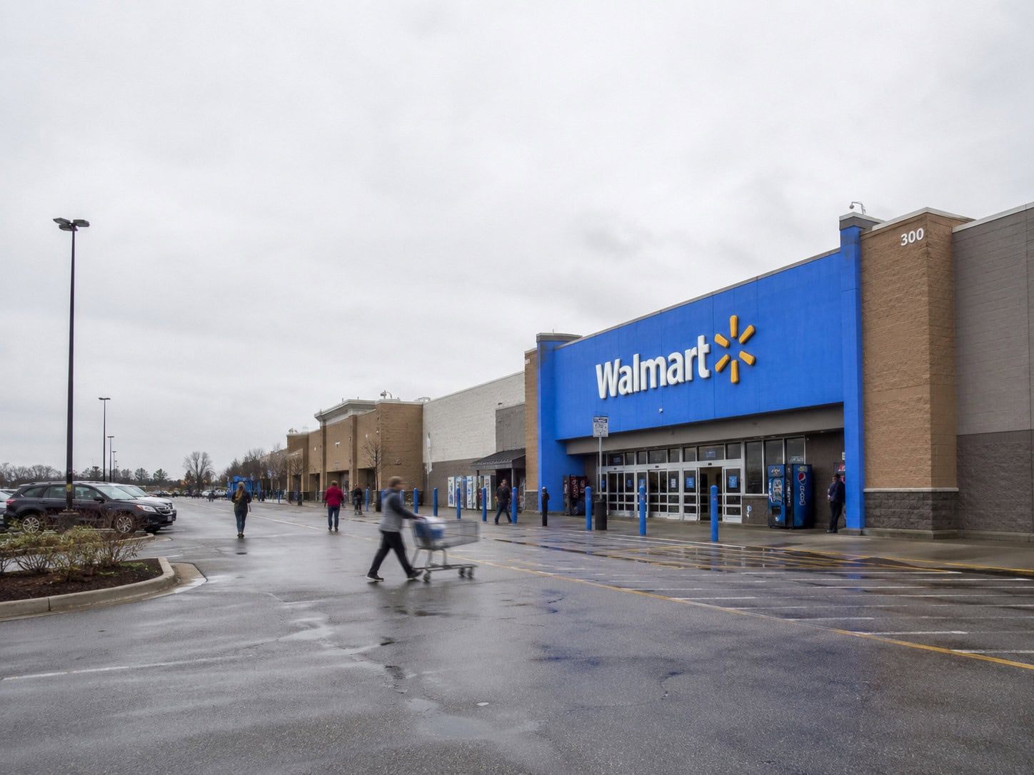 Exterior of a Walmart store on an overcast day, illustrating an article about executive departures under CEO John Furner