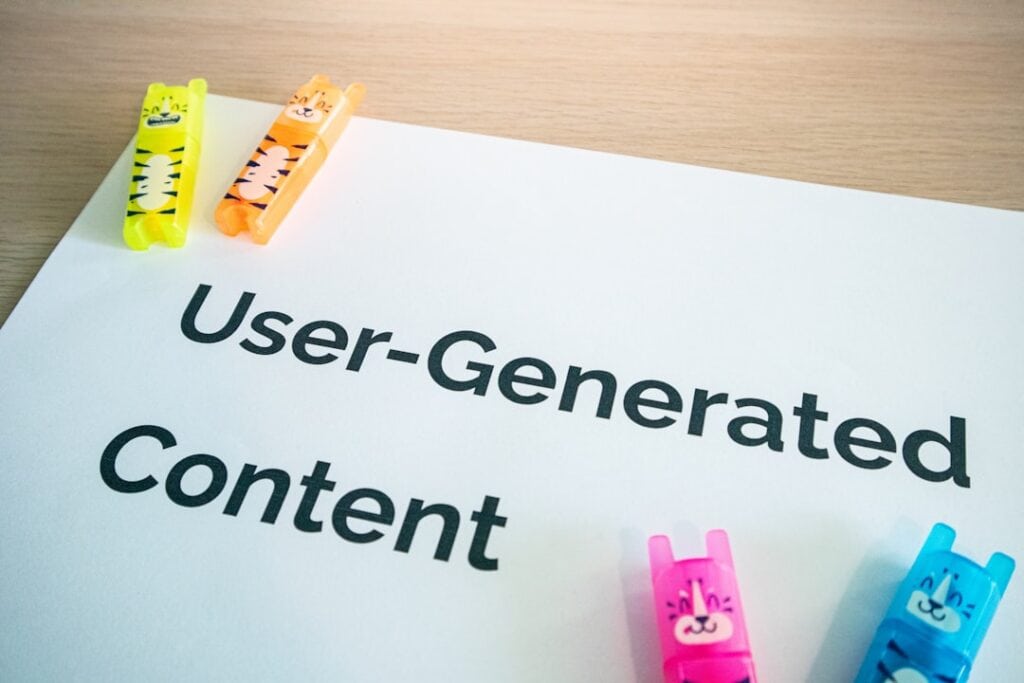 Colorful clips on paper with 'User-Generated Content' text for marketing strategy.