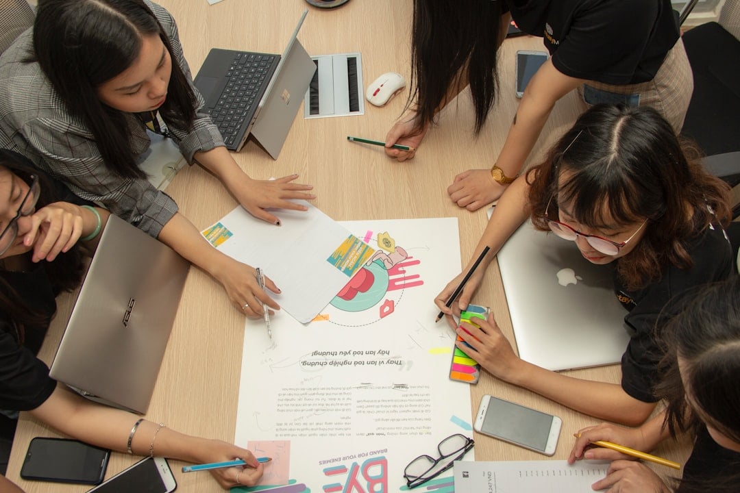 Team of professionals collaborating on business strategy at a meeting table.