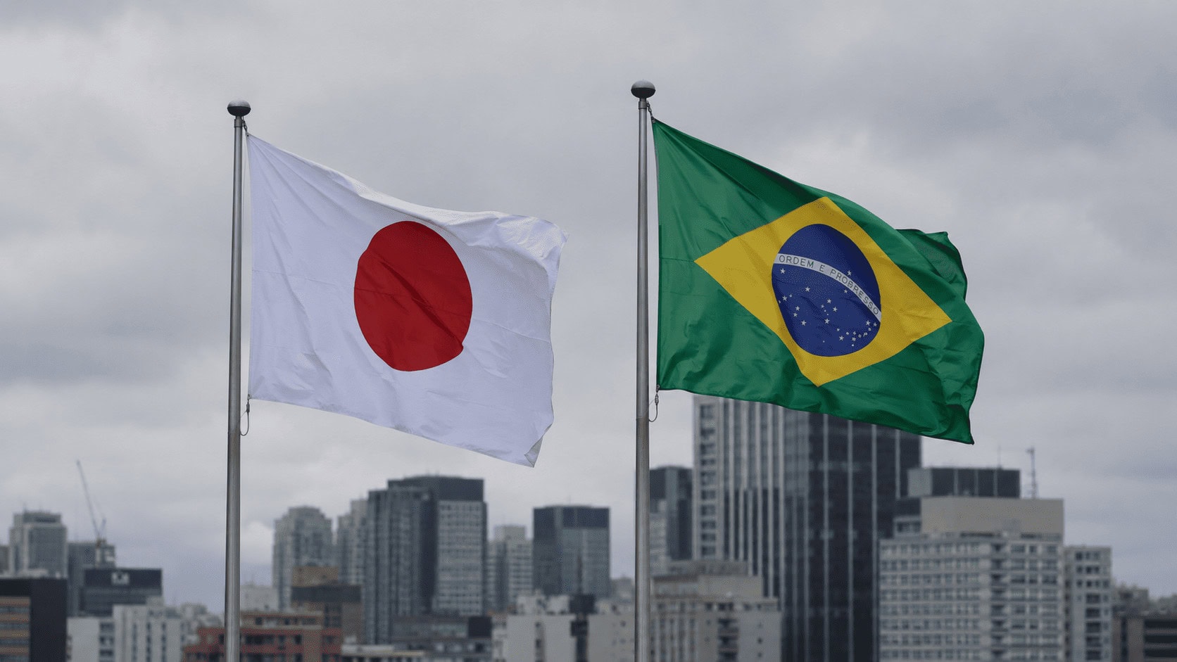 The flags of Japan and Brazil displayed side by side, representing a comparison of the two economies.