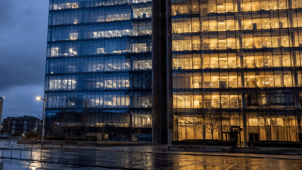 Corporate headquarters tower visually divided in two, illustrating Comcast's split into separate connectivity and media companies.