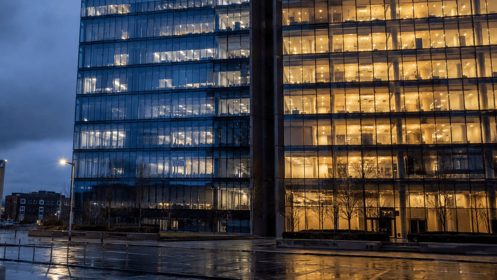 Corporate headquarters tower visually divided in two, illustrating Comcast's split into separate connectivity and media companies.