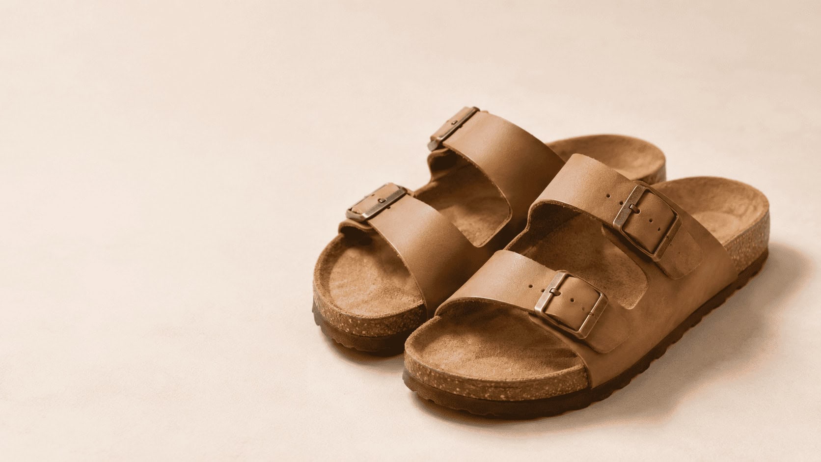 Pair of iconic Birkenstock cork-and-leather sandals on a neutral background, illustrating a 2026 SWOT analysis of Birkenstock.