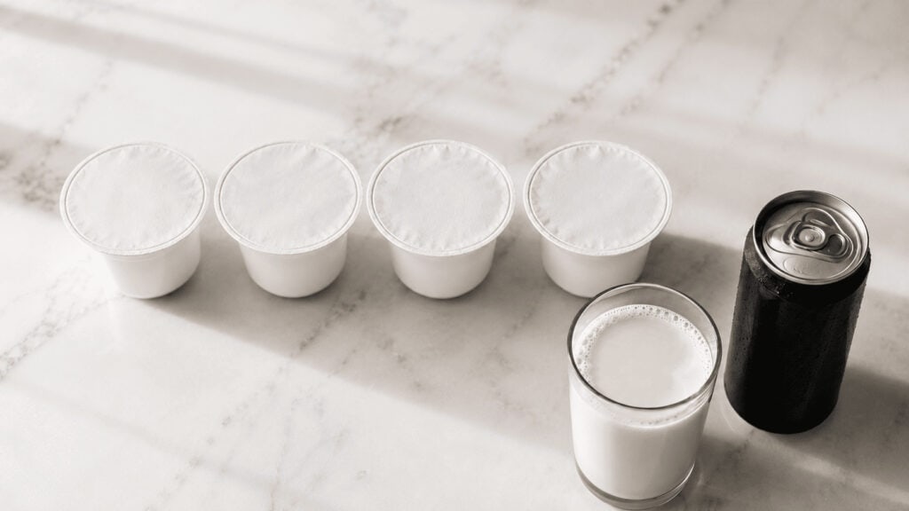 Greek yogurt cups, oat milk, and iced coffee representing Chobani's product portfolio
