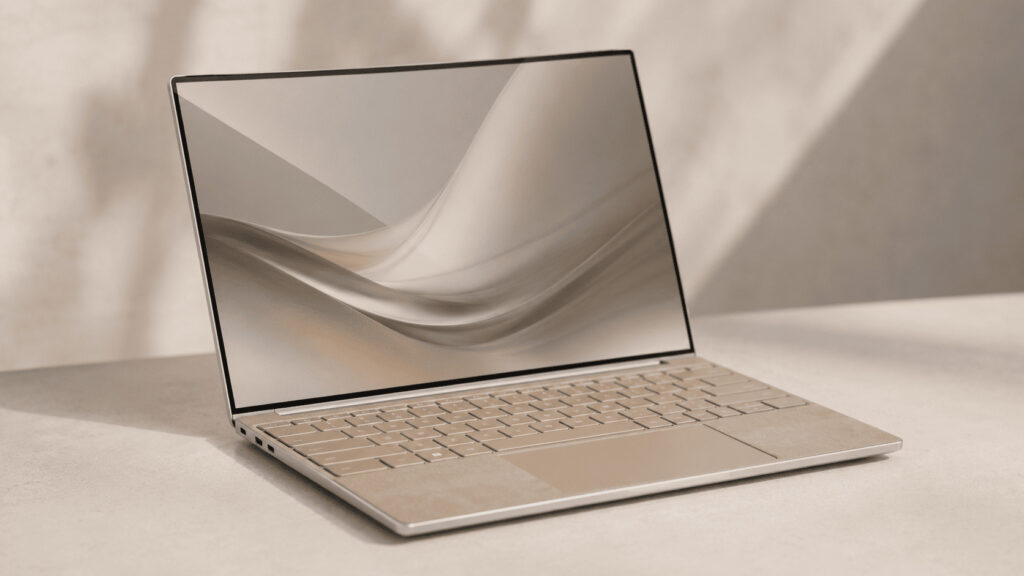A slim premium Windows ultraportable laptop open on a neutral desk, representing HP's OmniBook Ultra 14 flagship.