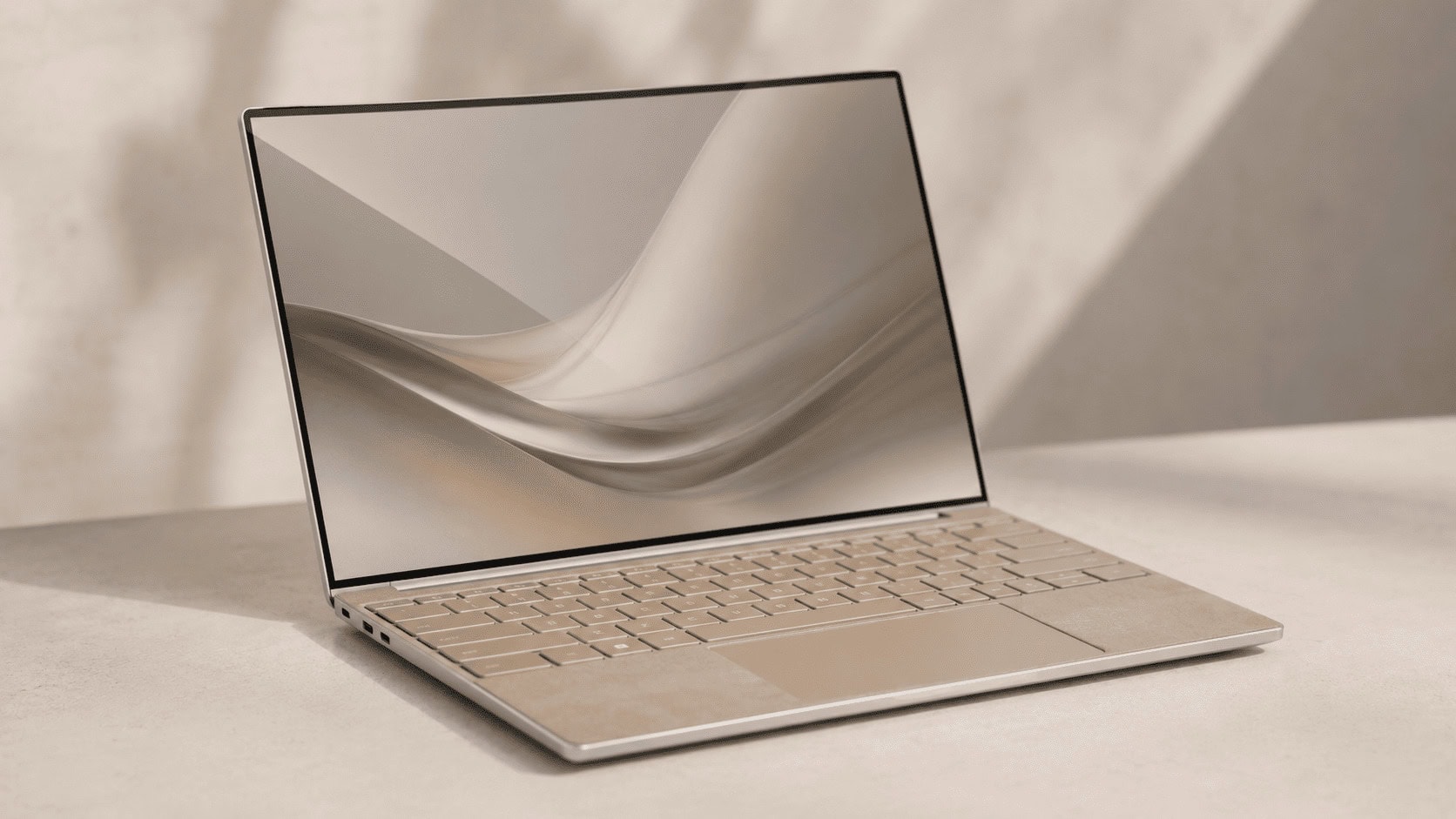 A slim premium Windows ultraportable laptop open on a neutral desk, representing HP's OmniBook Ultra 14 flagship.