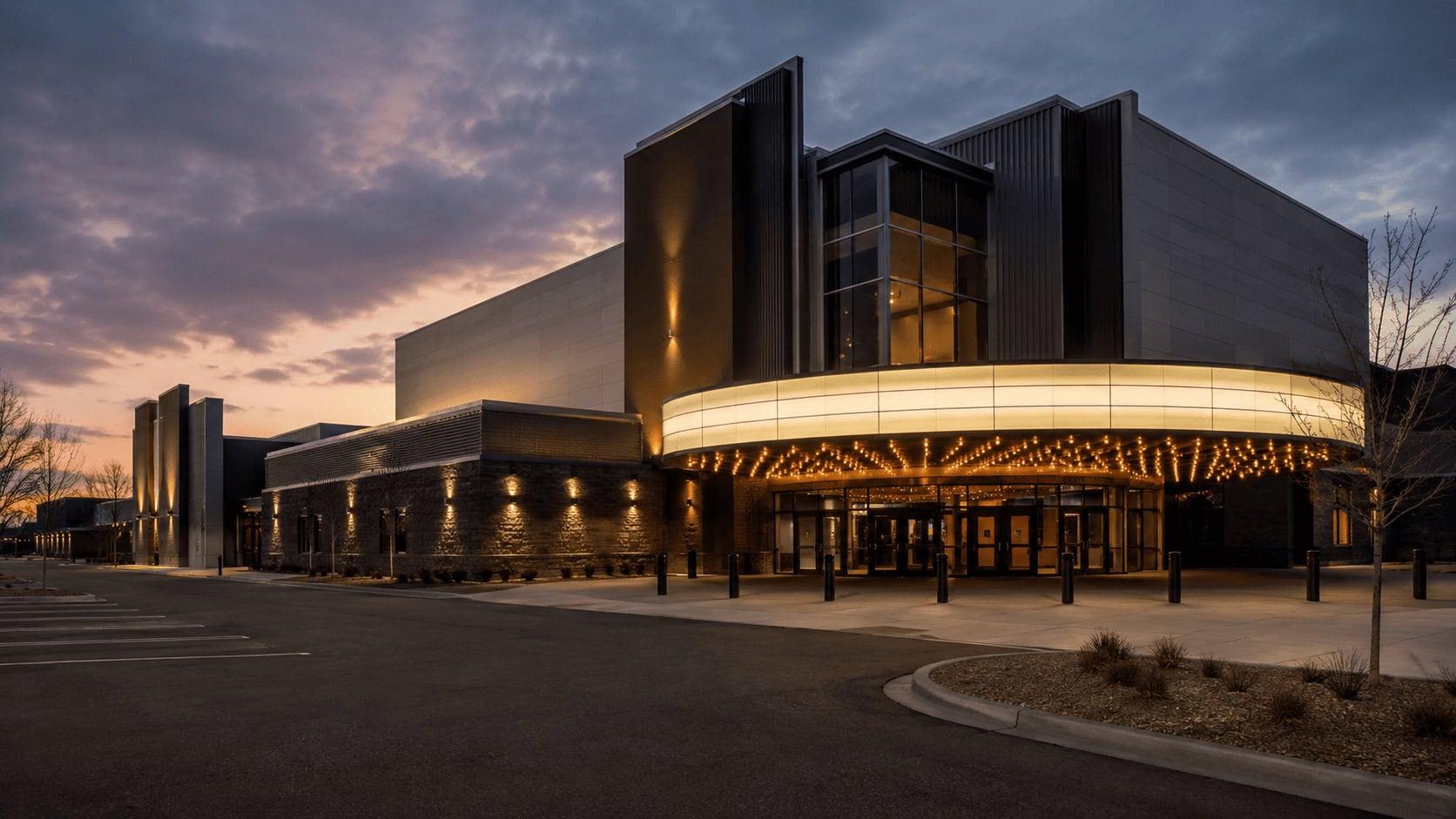 Cinema exterior at dusk representing the theatrical box office market where Lionsgate's Michael crossed $1 billion