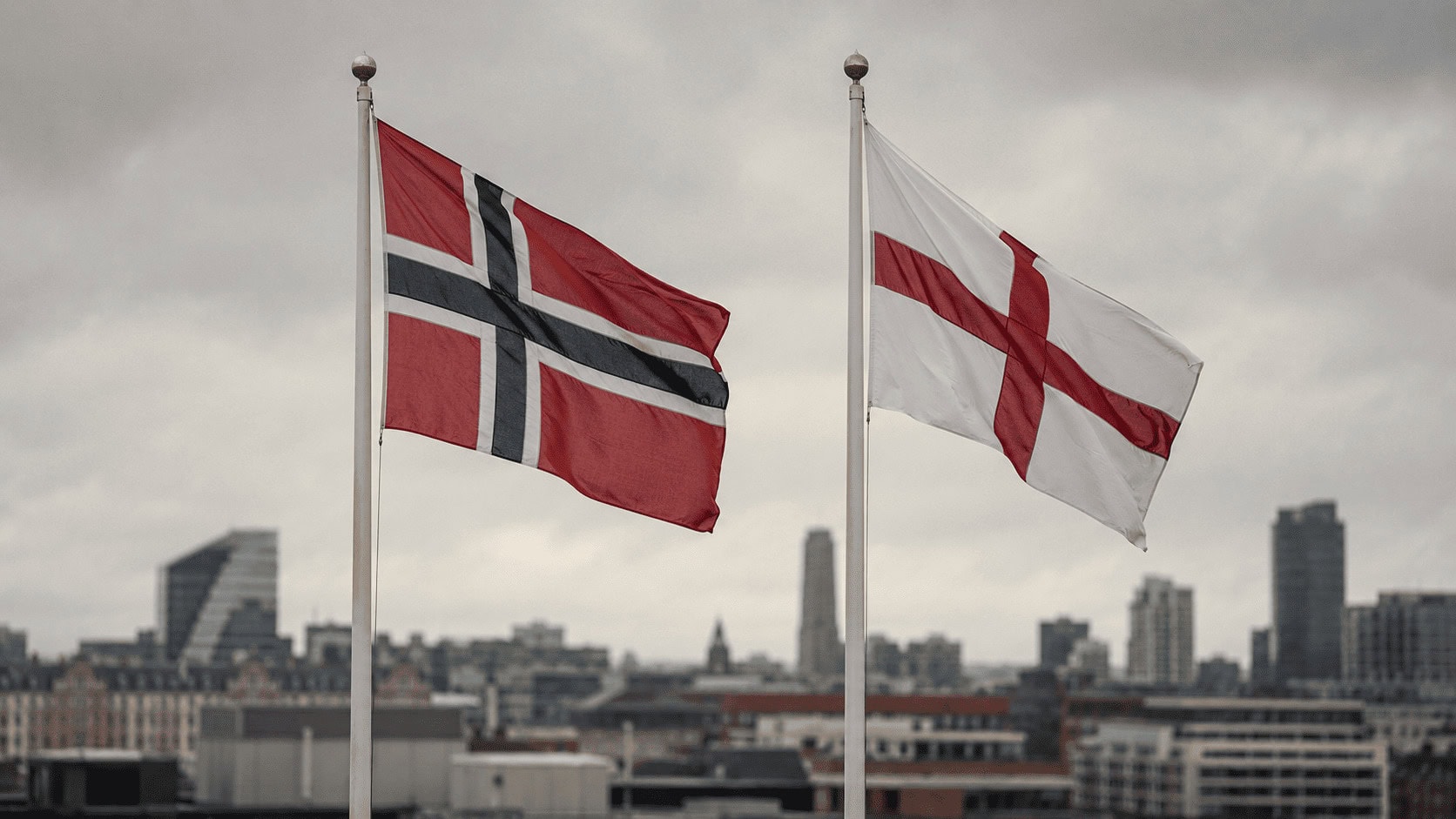 Split illustration contrasting Norway's oil-funded sovereign wealth vault with England's London financial skyline, divided by a football at center.