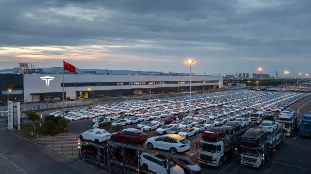 Rows of new Tesla cars at Gigafactory Shanghai staged for export, illustrating the Tesla China business at stake in a SpaceX merger