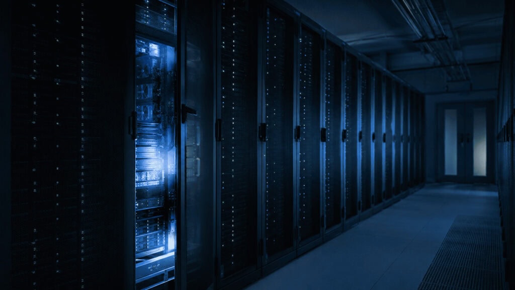 Server room with one open rack, illustrating an AI model reaching real company systems during testing.