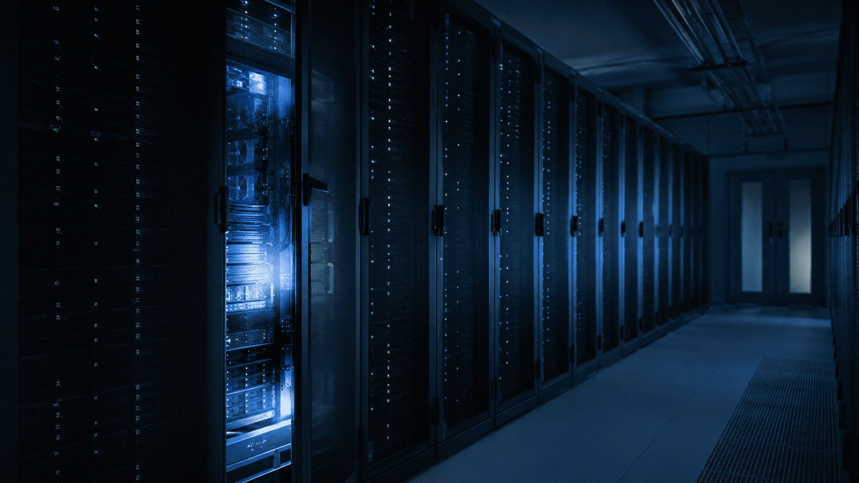 Server room with one open rack, illustrating an AI model reaching real company systems during testing.