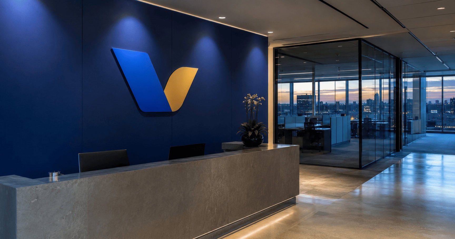 Empty workstations behind a Visa-branded office wall as the payments network cuts 2,600 technology and product roles
