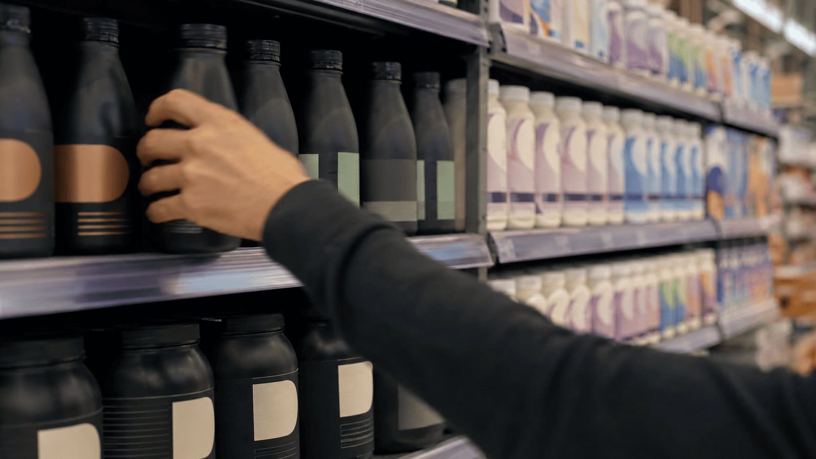 Plant-based meal replacement shakes and nutrition powders on a UK supermarket shelf beside medical nutrition drinks