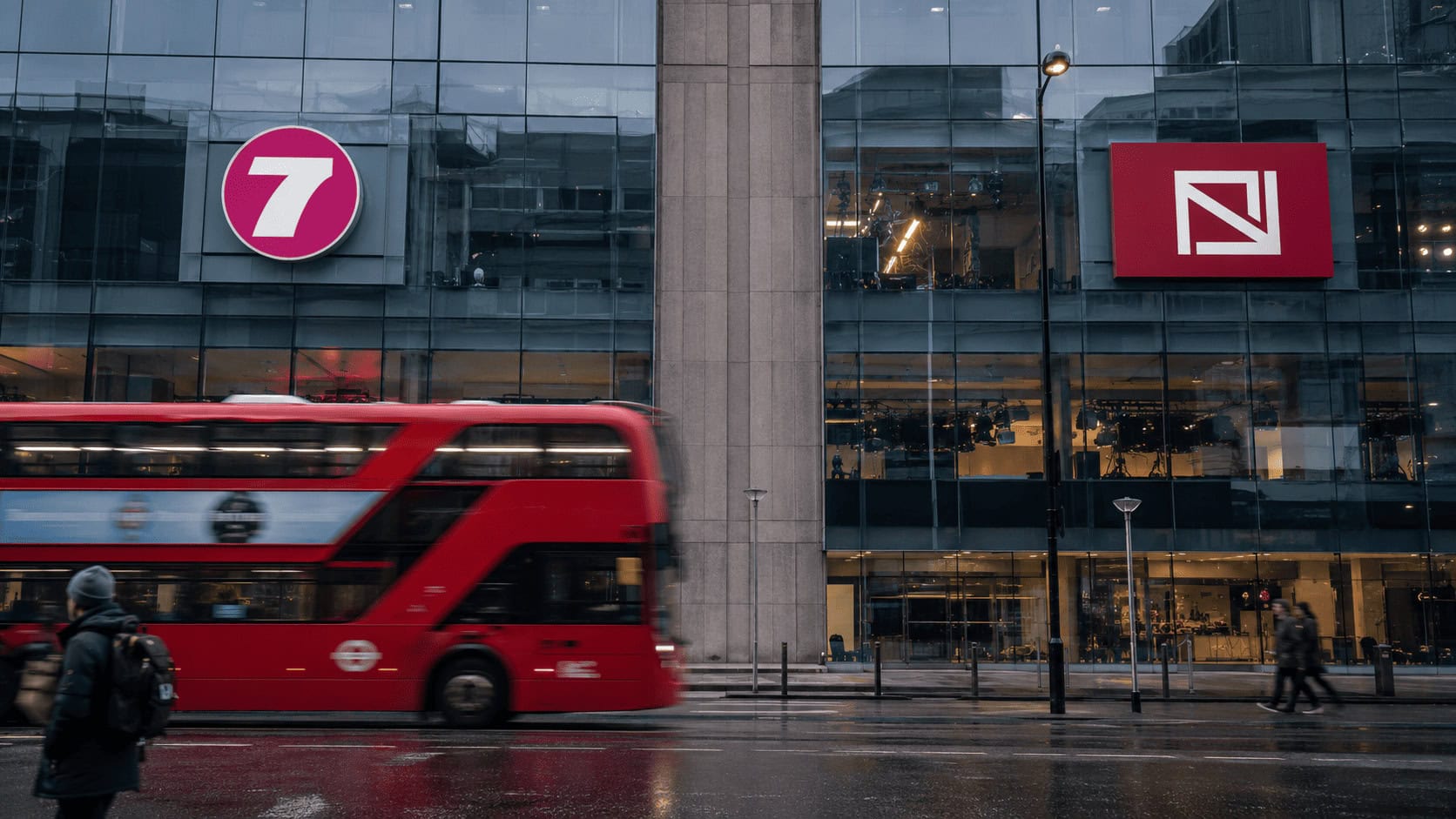 Channel 5 and CNN International branding on a London broadcast building, representing the UK government's conditions on the Paramount Warner Bros. Discovery merger.
