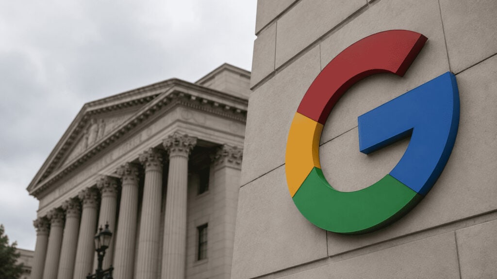 Google logo on a building exterior with an American courthouse facade visible behind it