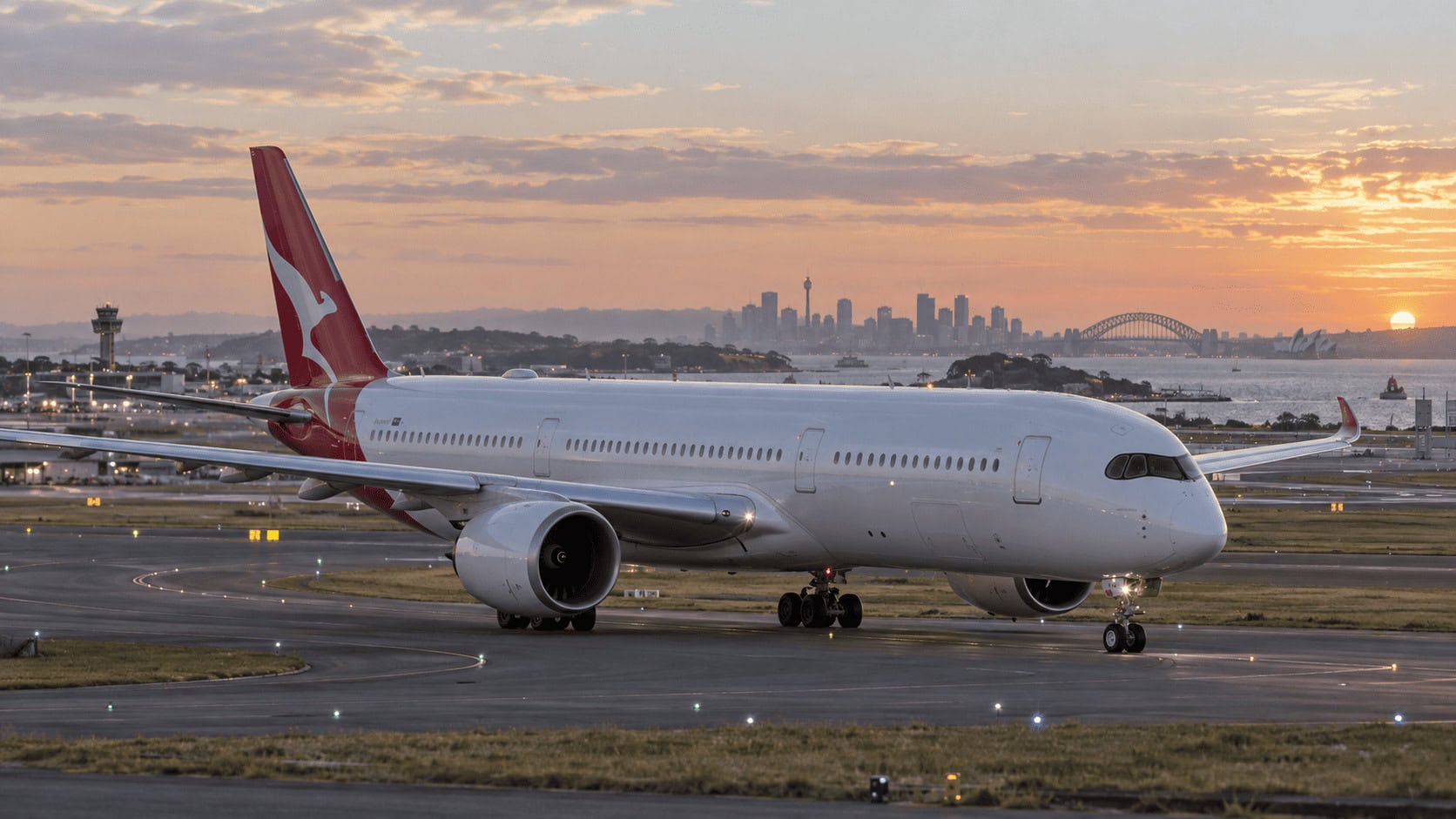 Qantas Airbus A350 taxiing at Sydney Airport at dawn ahead of a long-haul departure