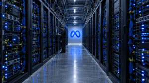 Server racks in a Meta data center aisle at night, the compute that ranks ads and now serves the Muse Wonder AI model